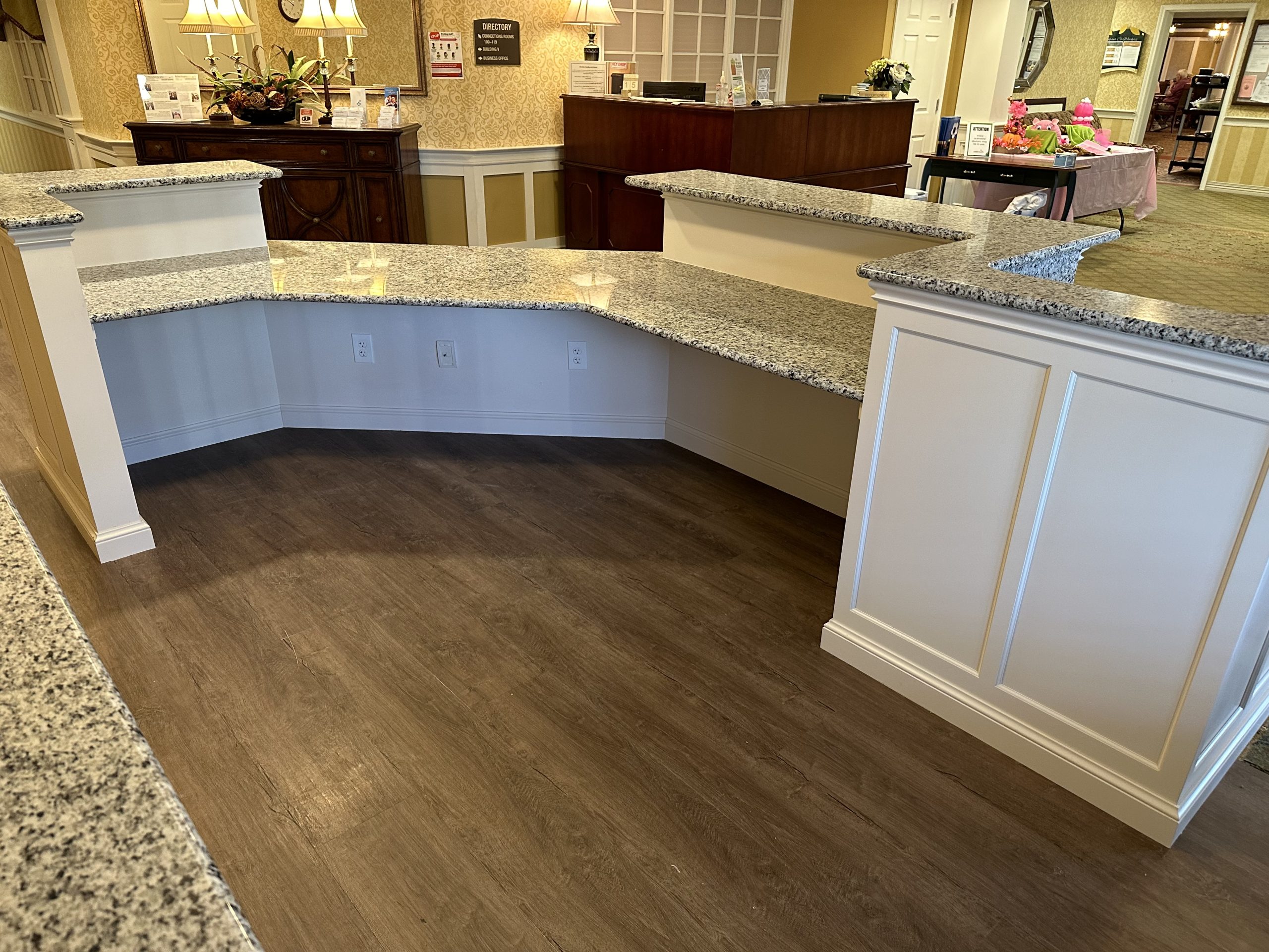 Wraparound reception desk with granite countertops